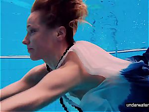 nubile dame Avenna is swimming in the pool